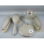 Five piece silver mirror and brush with covered jar dressing table set