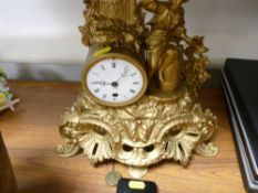 Gilt pendulum mantel clock with figural and scroll decoration etc
