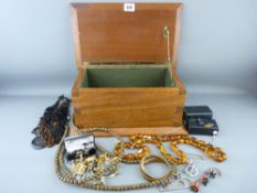 Teak lidded box containing a set of amber type beads and other jewellery and collectables