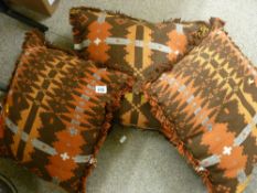 Three Welsh blanket style cushions