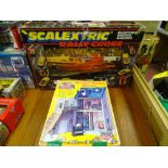 Boxed Scalextric Raleigh Cross set and a Haunted Badger Mansion by Tomy