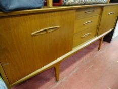 Teak mid Century sideboard with three central drawers