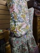 Upholstered floral covered bedroom chair and footstool