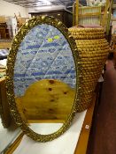 Gilt framed oval bevelled mirror and an Ali Baba basket