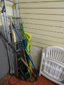 Two aluminium stepladders and a parcel of long handled garden tools, Ryobi strimmer etc E/T