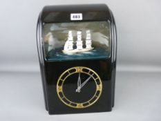 Vitascope black bakelite automaton clock with numerical dial and threemaster ship