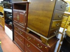 Parcel of dark wood furniture including wide six drawer chest, two door entertainment cupboard and