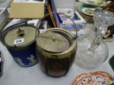 Wedgwood Jasperware biscuit barrel, another biscuit barrel and an etched glass claret jug