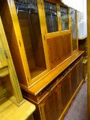 Dresser with four drawers over a four cupboard base and four upper etched glazed doors
