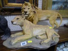 Good size Country Artist or similar model of a lion and lioness, approximately 52 cms long