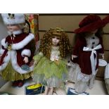 Three porcelain headed dolls with stands, two with certificates from the Porcelain Doll Collection