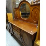 An Edwardian mahogany circular mirror backed sideboard with inlaid decoration, three drawers flanked