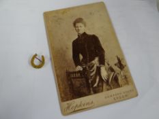 A believed 9ct yellow gold horse shoe brooch together with a photo of a Bessie Ackland wearing the