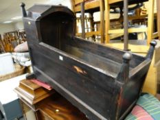 A nineteenth century stained wooden rocking crib
