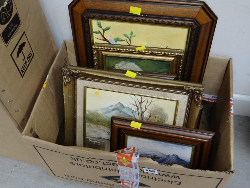 A box of various framed pictures