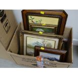 A box of various framed pictures