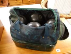 Set of four crown green bowls and bag
