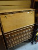 A vintage drop down bureau with brass handles & four drawers