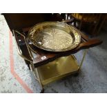 A vintage circular brass top decorated folding table, tea trolley & circular gilt framed mirror