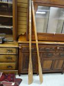 A pair of vintage pine rowing oars
