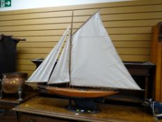 A single mast three sail pond yacht