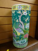 A Famille-Vert ceramic umbrella-stand decorated with peacocks