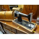 A vintage cased Singer sewing machine