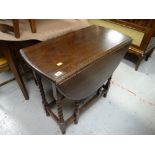 A vintage oak barley-twist drop leaf small dining table