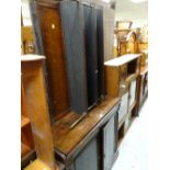 An early twentieth century rosewood chiffonier with open shelf top with brass supports