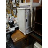 A painted white small cabinet, similar high-back chair together with a modern light wood & glazed