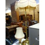 A polished brass standard lamp together with a table lamp E/T