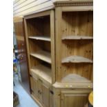 A modern pine unit three shelves with a cupboard base together with a similar pine standing corner