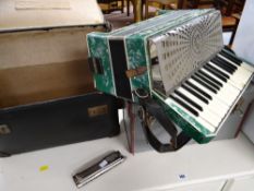 A cased Soporine piano accordion together with an M Hohner 64 chromonica harmonica