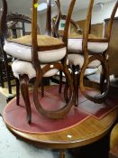 Early twentieth century circular mahogany dining table together with four balloon backed & cushion