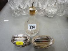 Silver topped cut glass bottle and two EP Ronson table lighters