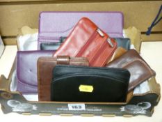Quantity of modern leather wallets and purses