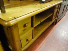 Pine coffee table with four drawers and centre shelf