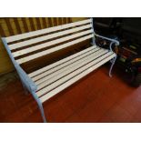 White painted garden bench with blue cast ends