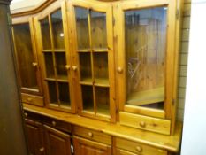 Pine dresser with four upper glazed doors