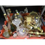 A crate of various metalware including decorated brass, decanters, bottles etc