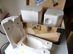 A wooden box containing five plaster slip moulds for pottery