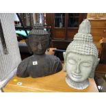 Cast metal Buddha's head together with a plaster Buddha's head