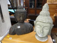 Cast metal Buddha's head together with a plaster Buddha's head