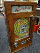 A vintage All Win Penny Play fairground machine