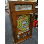 A vintage All Win Penny Play fairground machine