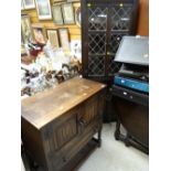 A small Old Charm-style cabinet together with a dark oak lead-glazed two-door standing corner