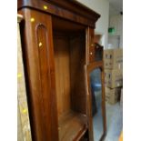 An Edwardian mahogany single mirror door wardrobe with single drawer base, 207 x 114 x 57cms