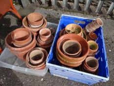 Two crates of various sized terracotta pots