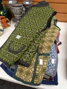 Eight various patterned ladies' sleeveless waistcoats fashioned from traditional Welsh blankets