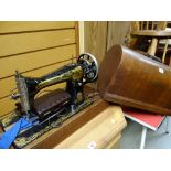 A vintage cased Singer sewing machine